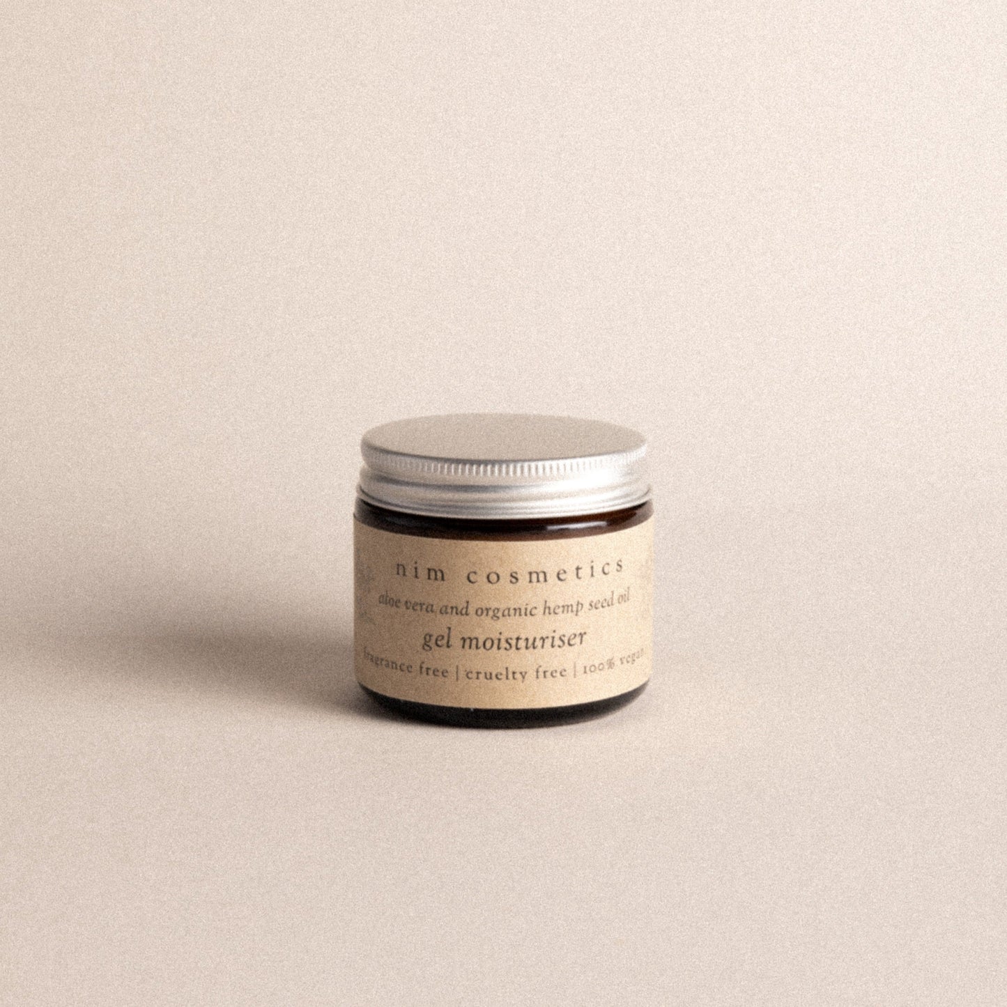 an image of a amber glass jar with a silver lid, with a label that reads - Nim Cosmetics, Aloe Vera and Organic Hemp Seed Oil Gel Moisturiser